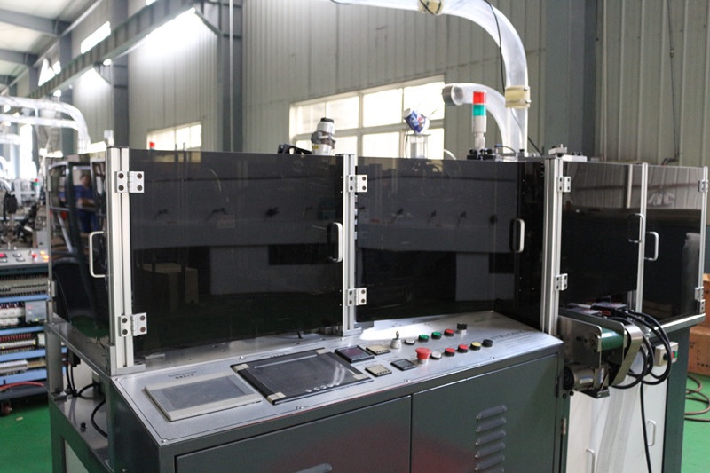 Paper cup machine safety enclosure and operator control area