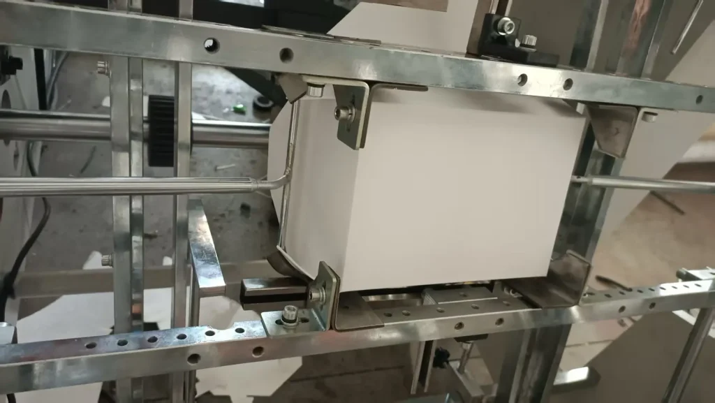 Hamburger box machine forming section with carton blank