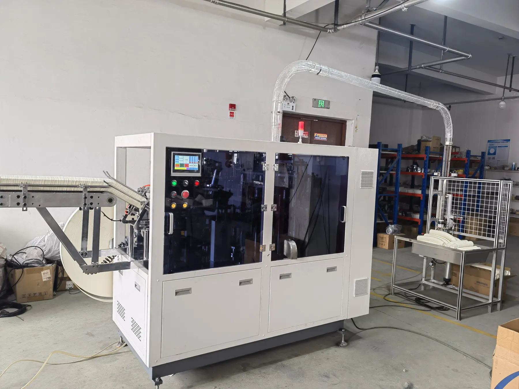 Roll-fed paper cup forming machine for unit weight and material usage planning