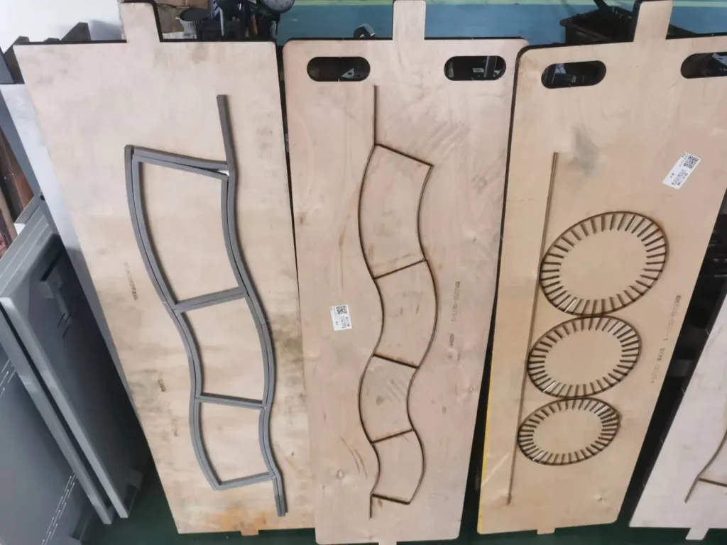 Paper cup fan and circular cutting tools displayed on wooden mounting boards